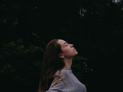 A calm outdoor scene suggesting deep breathing and fresh air.